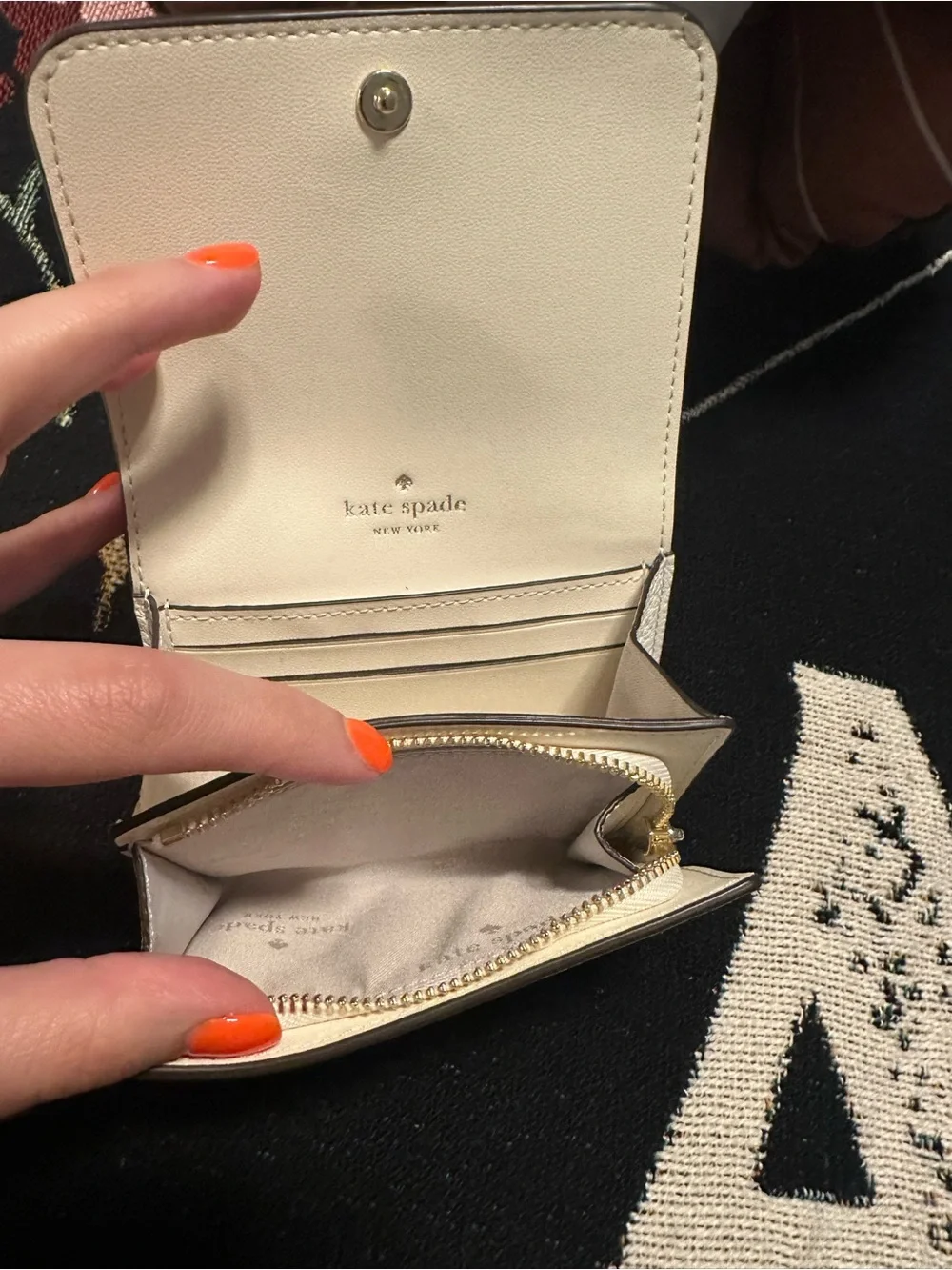 kate spade cream pebbled leather small zip wallet with gold spade emblem